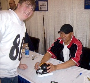 Chris Porter getting a mini helmet signed by Hines Ward